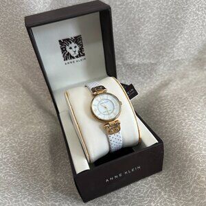 Anne Klein Women's 10-9888MPWT White Dial Gold-Tone Steel White Leather Strap